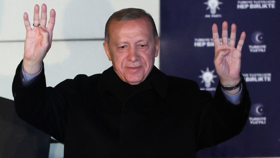 Turkish President Tayyip Erdogan greets supporters at the AK Party headquarters in Ankara, Turkey.