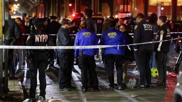 New York Police Department (NYPD) personnel investigate the scene of a shooting at the Mount Eden Avenue subway station in the Bronx borough of New York City, U.S. February 12, 2024.
