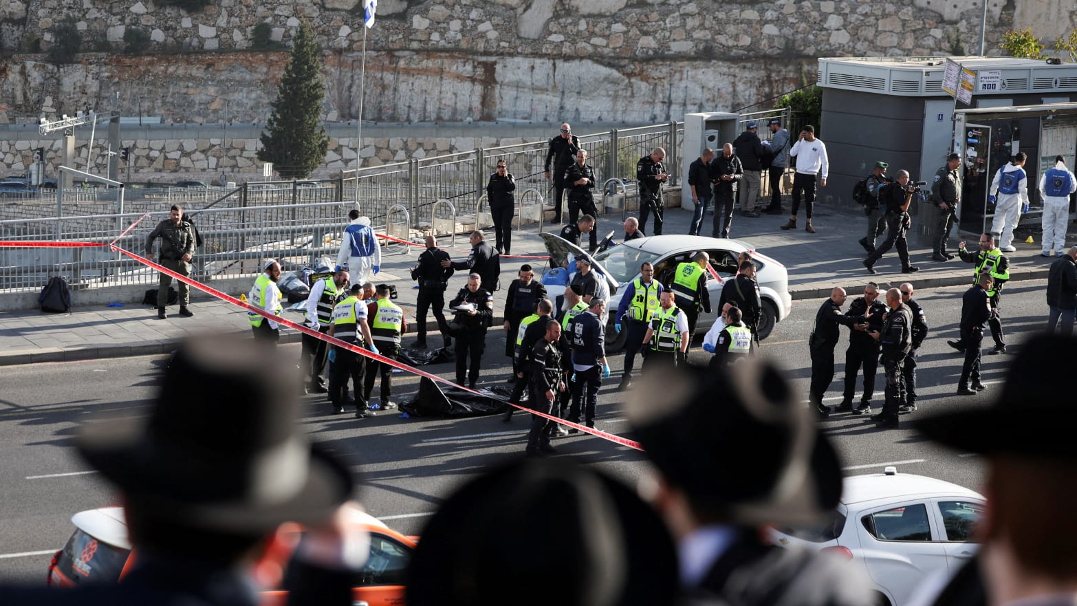 Israeli officials work at the scene of a violent incident in Jerusalem November 30, 2023.