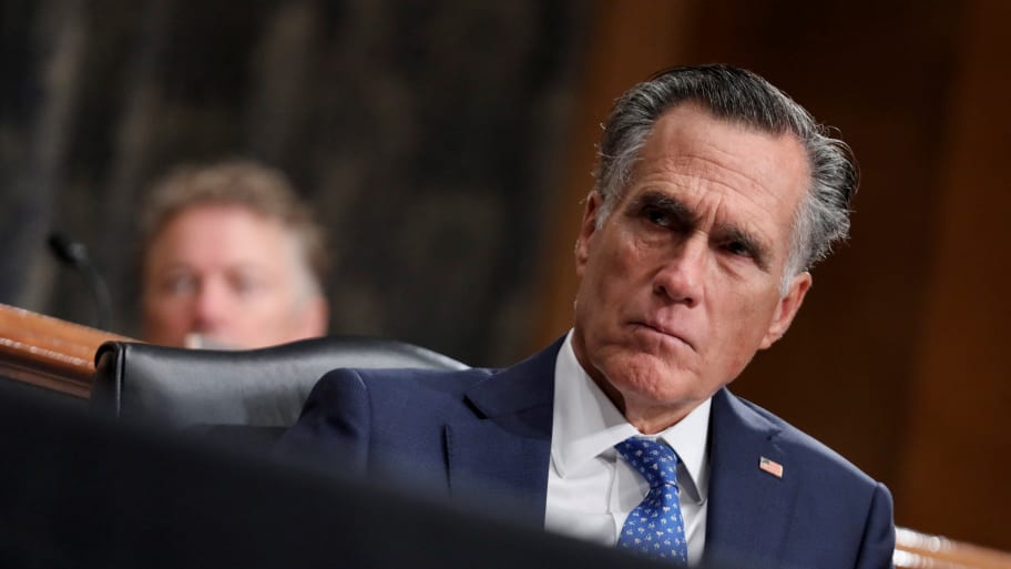 Senator Mitt Romney listening to a hearing.
