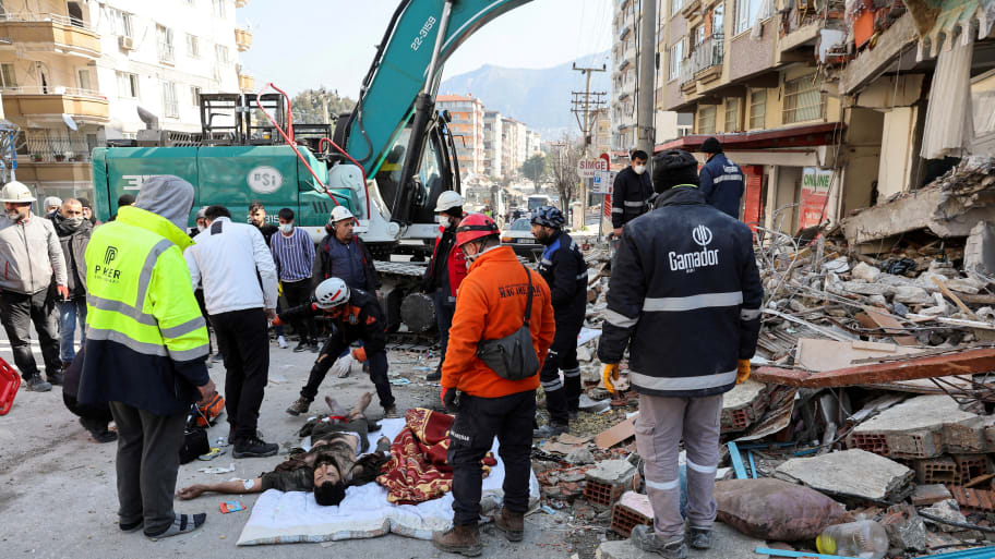 Rescuers provide medical attention to a survivor of the Turkey earthquake.
