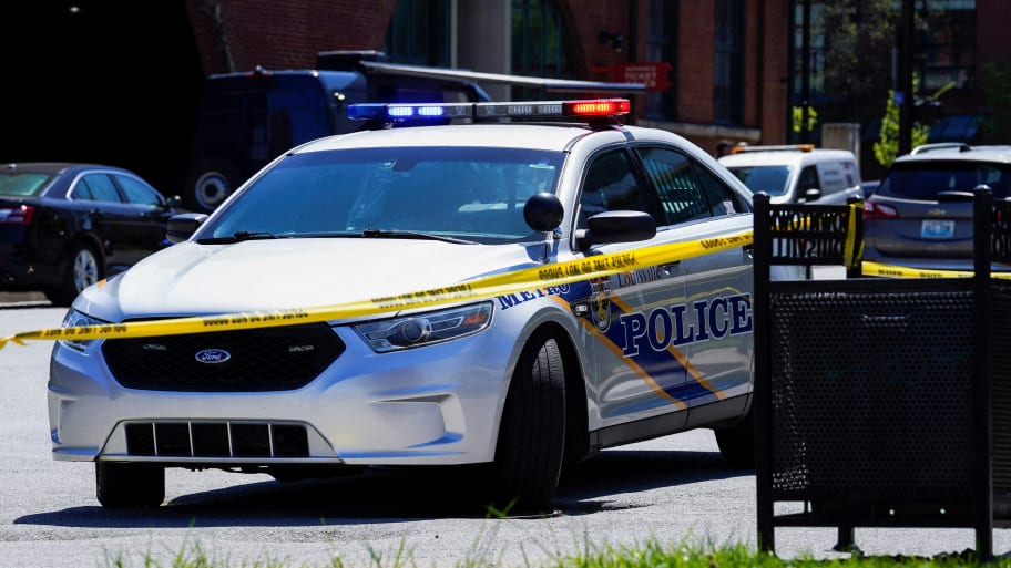 A police cruiser responds at the scene of a mass shooting at an Old National Bank branch near Slugger Field baseball stadium in downtown Louisville, Kentucky, U.S. April, 10, 2023.