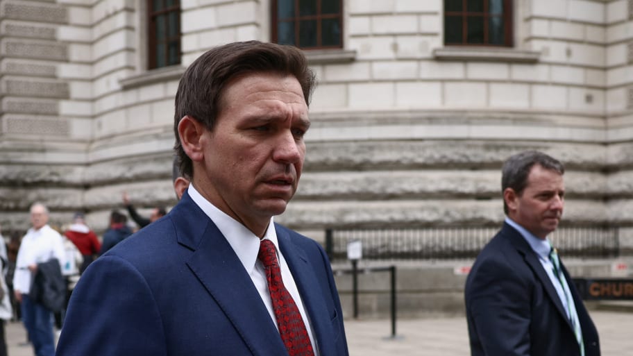 Florida Governor Ron DeSantis walks outside the Treasury during his visit in London, Britain April 28.