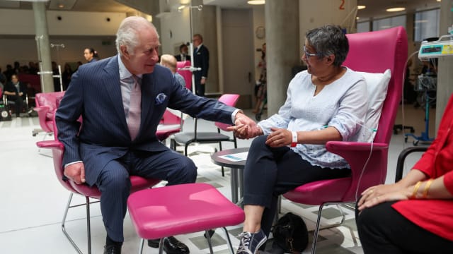 King Charles meets with patients during a visit to the University College Hospital Macmillan Cancer Centre in London, April 30, 2024. 