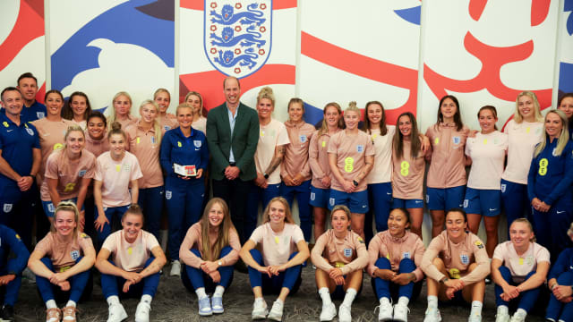 Britain's Prince William, President of The Football Association, poses with the England Women's team before the Women's World Cup.