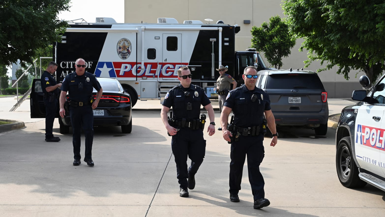 Officers with the Allen Police Department man the mobile command post the day after a gunman shot multiple people at the Dallas-area Allen Premium Outlets mall in Allen, Texas, May 7, 2023.