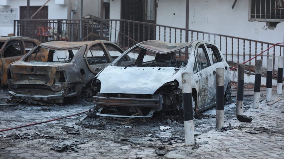 A view of burnt out cars in the area of Al-Ahli hospital in Gaza City