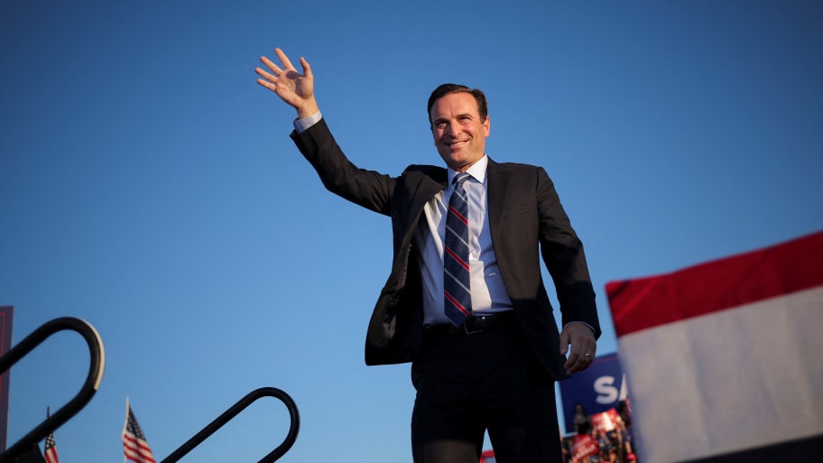 Nevada Republican nominee for U.S. Senate Adam Laxalt waves during a rally held by former U.S. president Donald Trump ahead of the midterm elections, in Minden, Nevada, U.S., October 8, 2022.