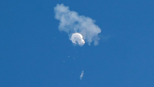 The suspected Chinese spy balloon drifts to the ocean after being shot down off the coast in Surfside Beach, South Carolina.