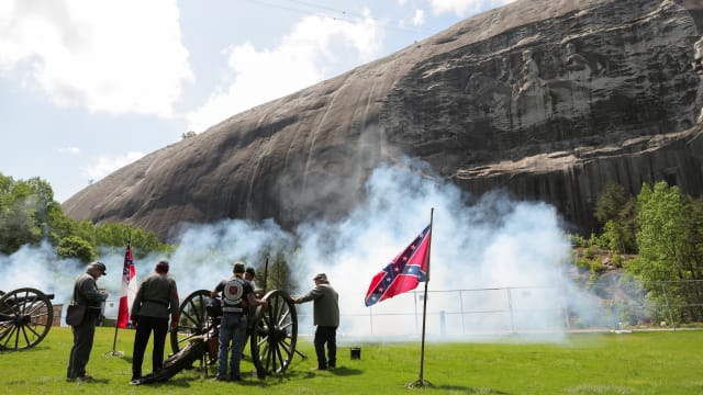 People set off cannons during Confederate Memorial Day at Stone Mountain Park in Stone Mountain, Georgia.