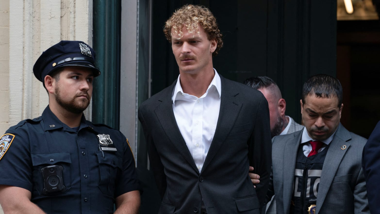 Former U.S. Marine Daniel Penny is taken from a New York City Police precinct under arrest for the death of Jordan Neely in New York City, U.S., May 12, 2023.