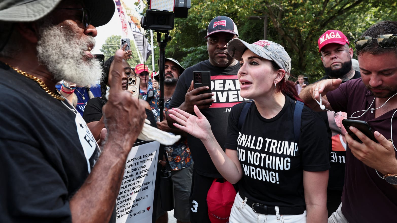 Laura Loomer speals demonstrators on August 24, 2023, near the entrance of the Fulton County Jail as former President Donald Trump prepared to turn himself in to be processed after being indicted in Atlanta, Georgia.