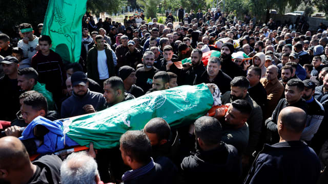 Palestinians attend a funeral of those killed in an airstrike in Jenin.