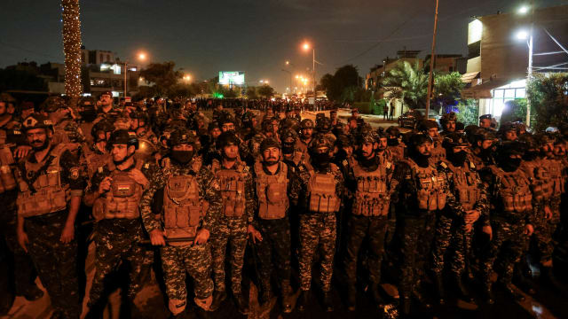 Iraqi security forces lined up in Baghdad.