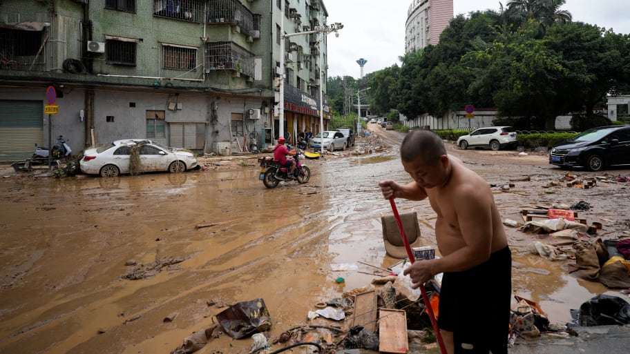 Man cleans up after flooding in Guangdong province