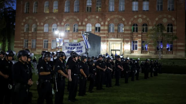 Law enforcement officers take position before entering the pro-Palestinian protest encampment at UCLA, as the conflict between Israel and the Palestinian Islamist group Hamas continues, in Los Angeles, California, U.S., May 1, 2024. 