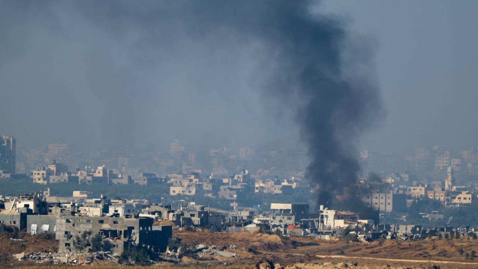 Smoke rises from damaged buildings in Gaza.