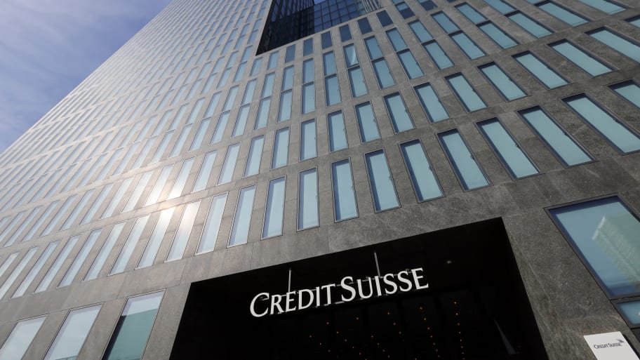 A view shows logo of Swiss bank Credit Suisse in front of an office building in Zurich, Switzerland, March 16, 2023. 