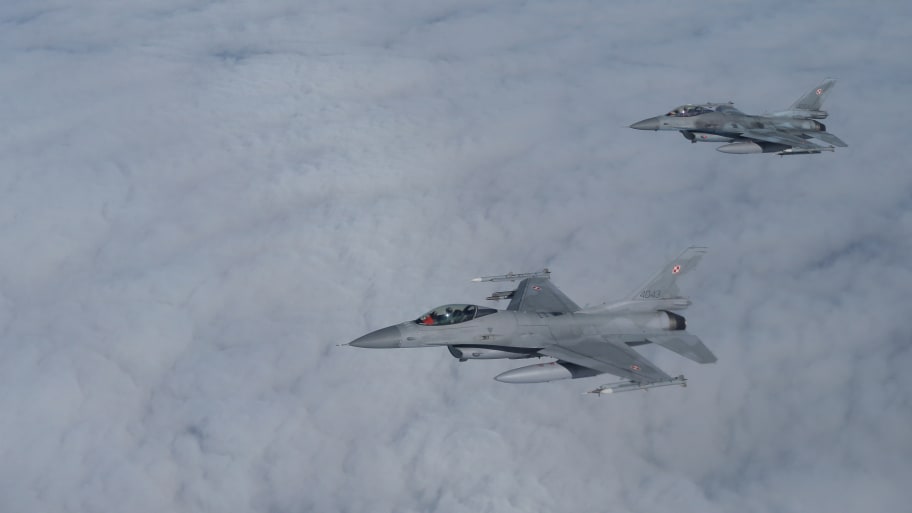 F-16 aircraft fly during a NATO media event at an airbase in Malbork, Poland, March 21, 2023.