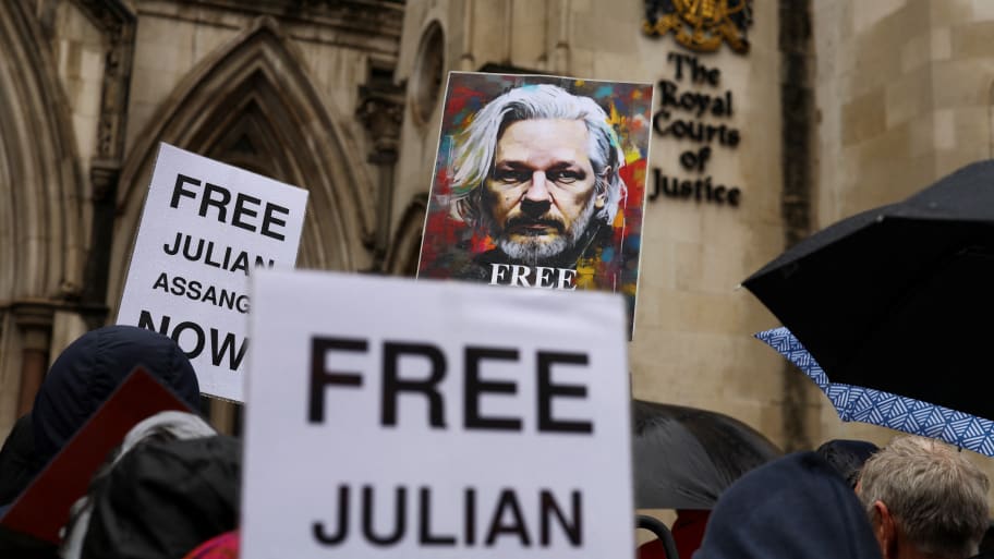 Supporters for Julian Assange rally outside a British courthouse.