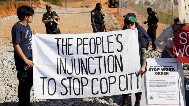 People protest at the site of the Atlanta police training center, derisively called "Cop City"