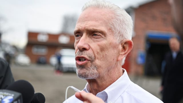 Congressman Bill Johnson speaks with the media as he attends a press conference after inspecting the site of a train derailment of hazardous material in East Palestine, Ohio