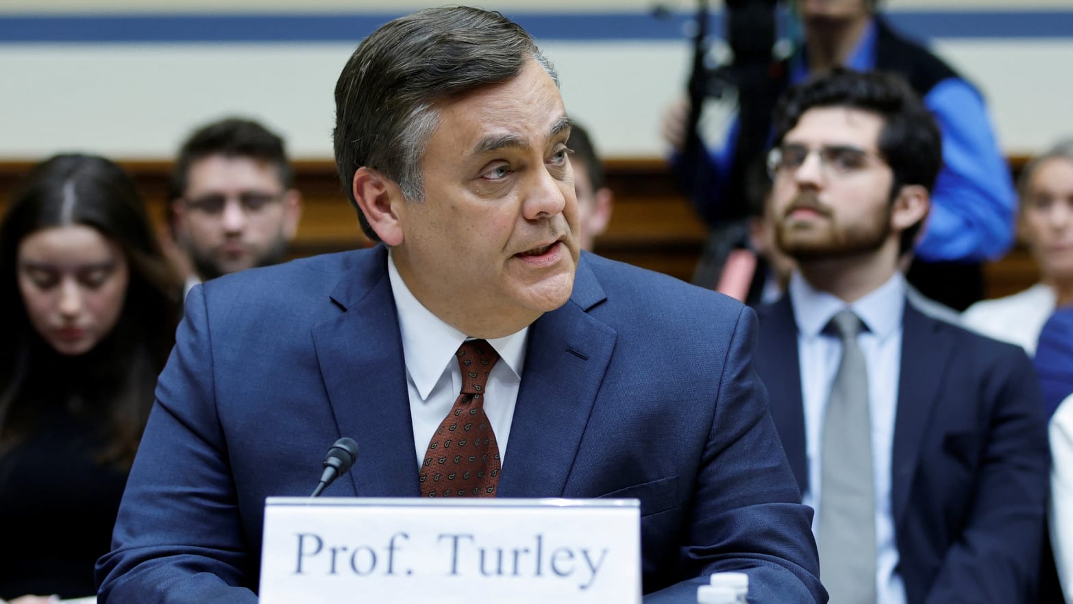 Jonathan Turley looks to the left while speaking during a House committee meeting.