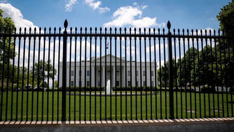 The White House seen behind the 13-foot fence.