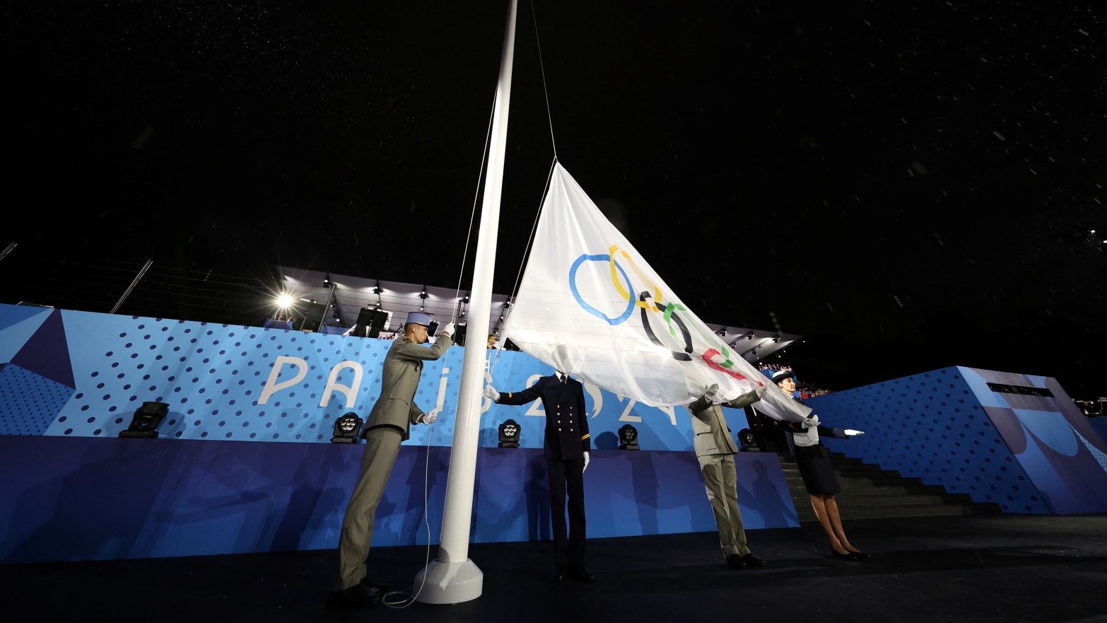 The Olympic Flag is raised at Place du Trocadero during the opening ceremony of the Olympic Games Paris 2024.   