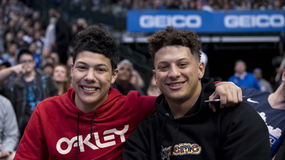 Jackson Mahomes (left) sitting with his arm around his brother, Patrick Mahomes (right).