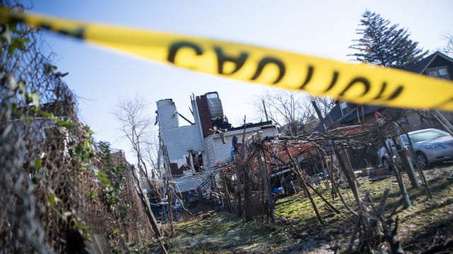 The remains of a home that was set ablaze and where at least six people remain unaccounted for in East Lansdowne, Pennsylvania.