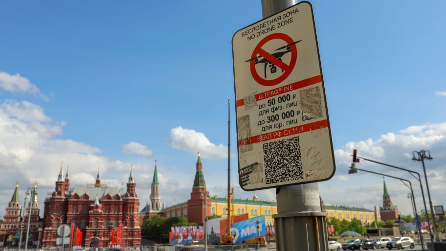 A sign prohibiting unmanned aerial vehicles flying over the area is on display near the State Historical Museum and the Kremlin in central Moscow, Russia, May 3, 2023.
