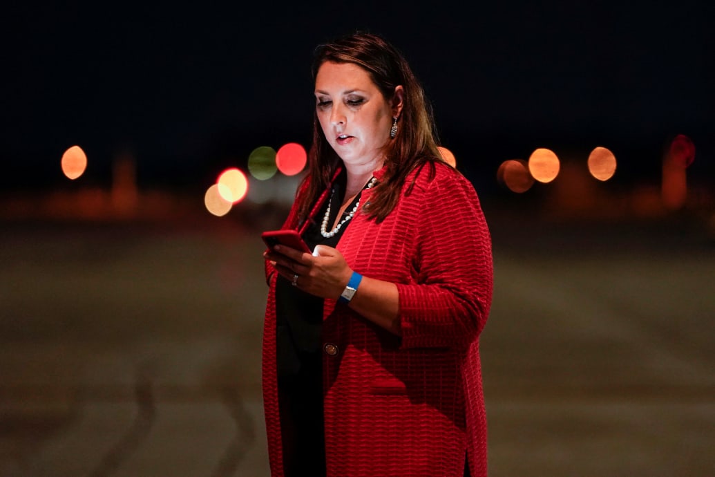 Former chair of the Republican National Committee Ronna McDaniel looks at her mobile phone
