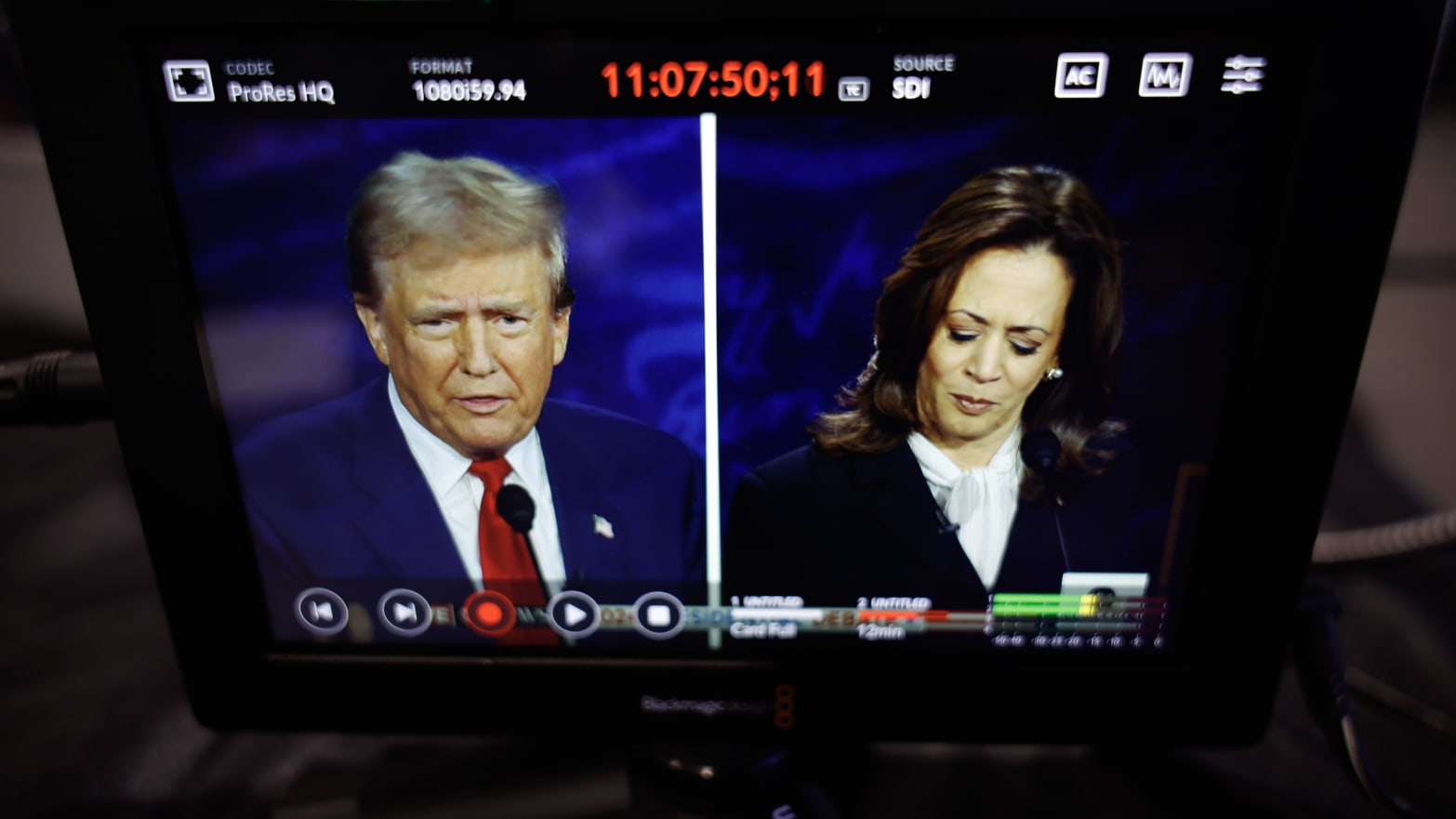 TV showing a spilt screen of Trump and Harris during the debate