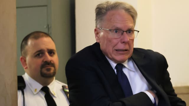 A photo of ex-NRA head Wayne LaPierre arriving in court.