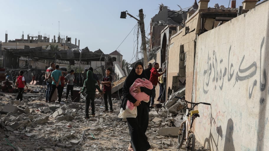 Palestinian Territories, Rafah: Palestinians inspect damaged houses after Israeli warplanes bombed a home for the Al-Shaer family