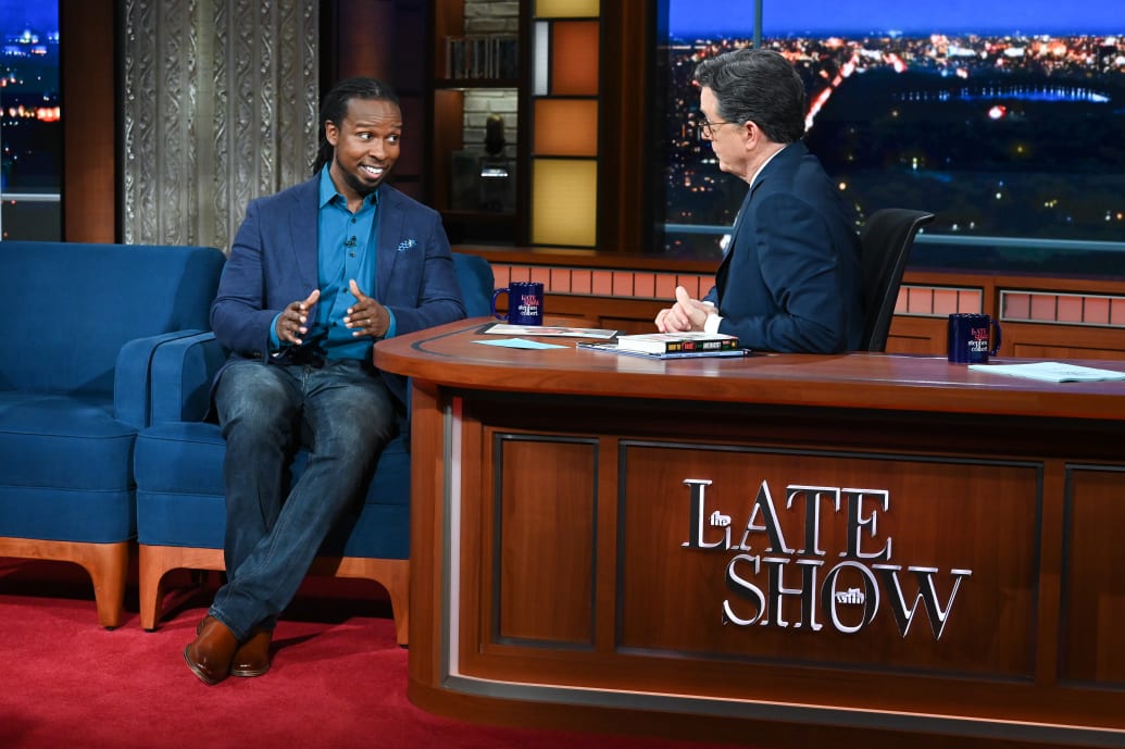 A photo of Ibram X. Kendi with Stephen Colbert on The Late Show