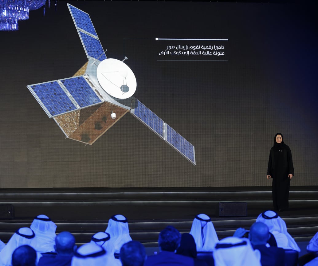 Amiri stands on stage during a ceremony to unveil the Mars Hope mission on May 6, 2015 in Dubai. 