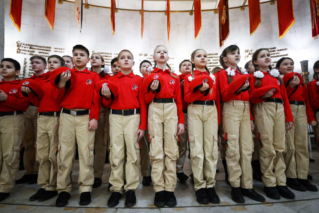A photograph of Russian teenagers attending a ceremony to join the patriotic Youth Army cadets movement in the main hall of the Stalingrad Battle Museum in Russia's southern city of Volgograd on January 25, 2023. 