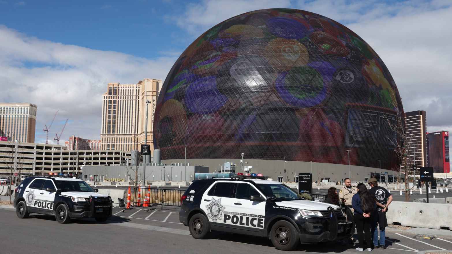 Individuals are seen in handcuffs near the Sphere after law enforcement responded to reports that pro-life activist Maison DesChamps (not pictured) had climbed to the top of the structure on February 07, 2024 in Las Vegas, Nevada. 