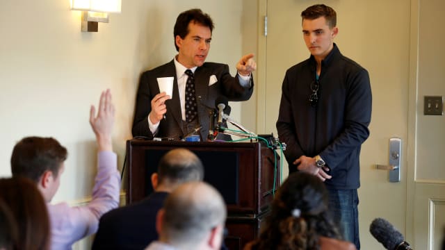 Jack Burkman, a lawyer and Republican operative, and Jacob Wohl (R), an internet activist and supporter of U.S. President Donald Trump, speak during a news conference on November 1, 2018.