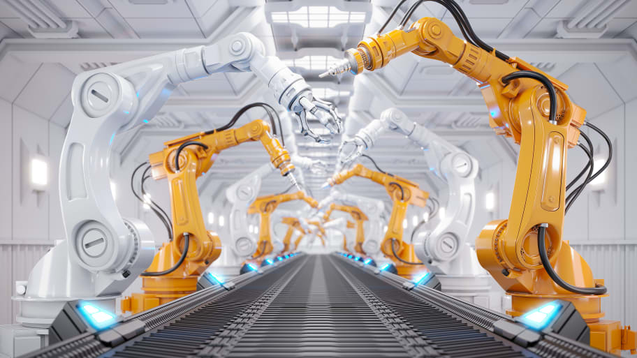 Robotic arms and a conveyor belt 