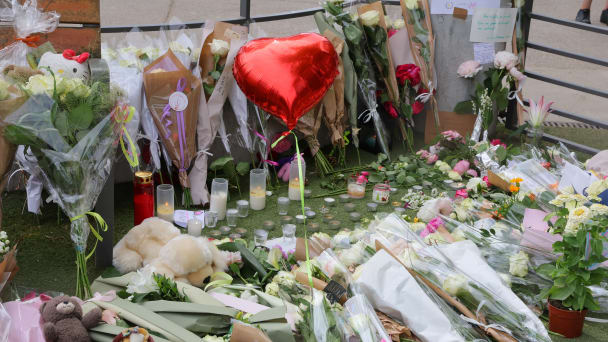 Flowers, candles and messages left to pay tribute to the victims are seen at the children's playground the day after several children and adults were injured in a knife attack n Annecy, in the French Alps, France, June 9, 2023.