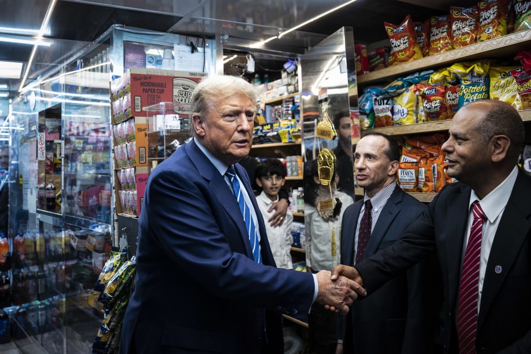 Trump shakes hands with Francisco Marte at Sanaa Convenient.