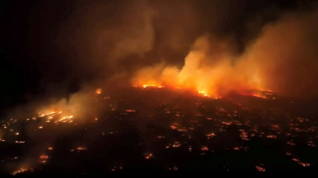 An aerial view of a wildfire in Maui County, Hawaii