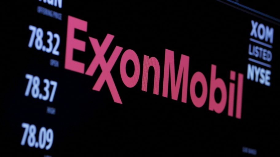 The logo of Exxon Mobil Corporation is shown on a monitor above the floor of the New York Stock Exchange.