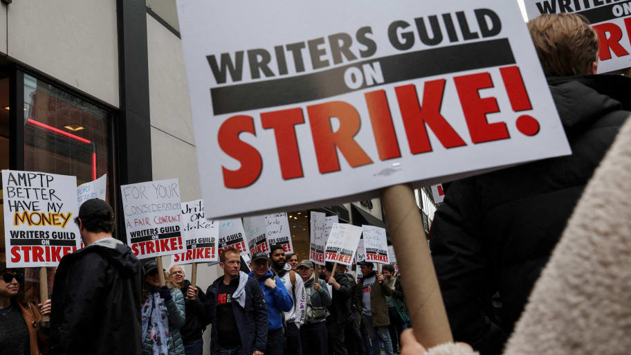 Members of the Writers Guild of America (WGA) East picket outside Peacock Newfront streaming service offices, in New York City, U.S., May 2, 2023.