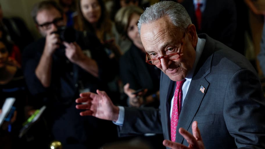 U.S. Senate Majority Leader Chuck Schumer (D-NY) peaks to reporters after the weekly Democratic party caucus luncheon at the U.S. Capitol on Capitol Hill.