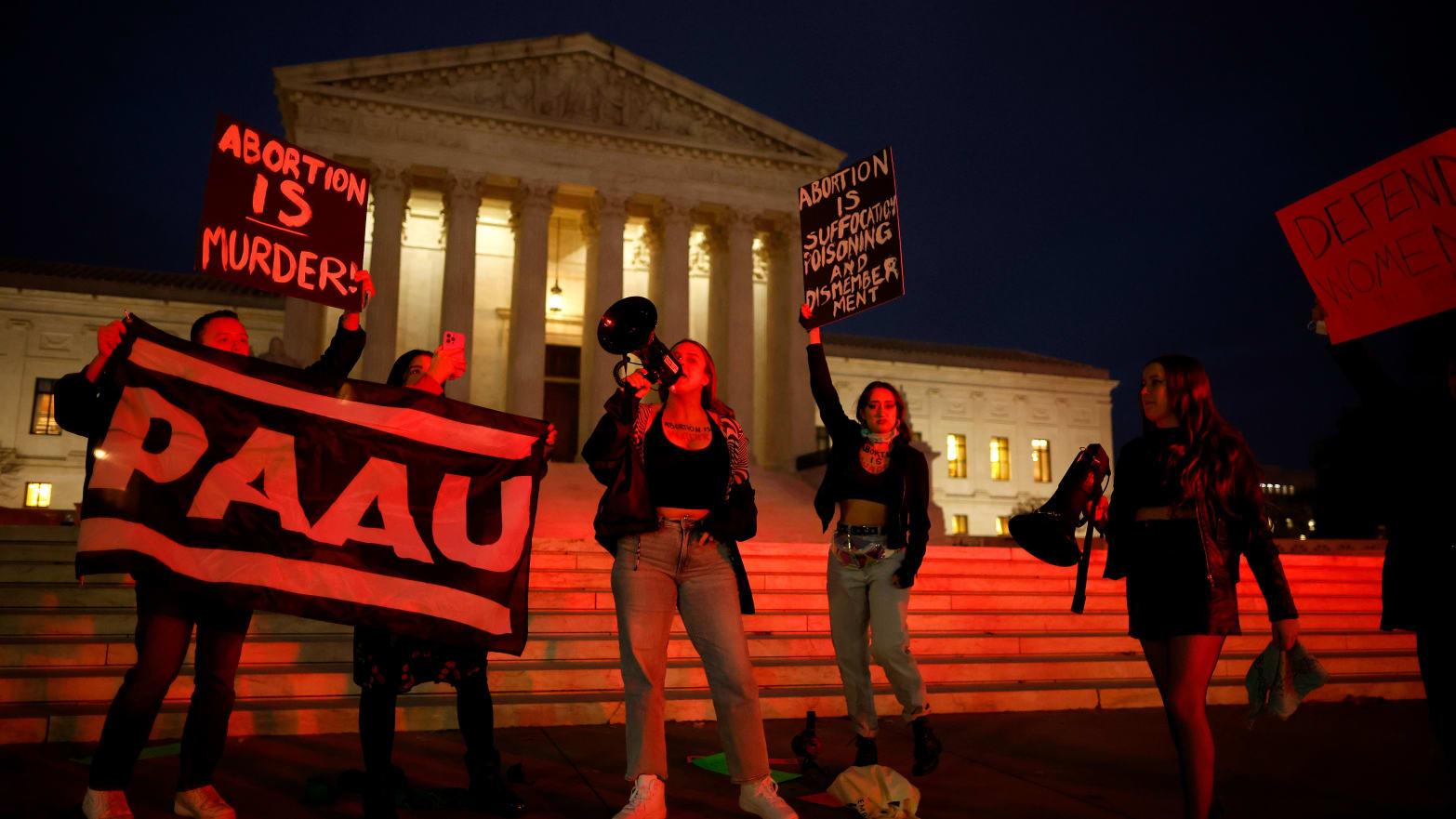 A photograph of members of the Progressive Anti-Abortion Uprising rally in front of the U.S. Supreme Court on the first anniversary of the oral arguments in Dobbs v. Jackson Women's Health Organization on December 01, 2022 in Washington, DC.
