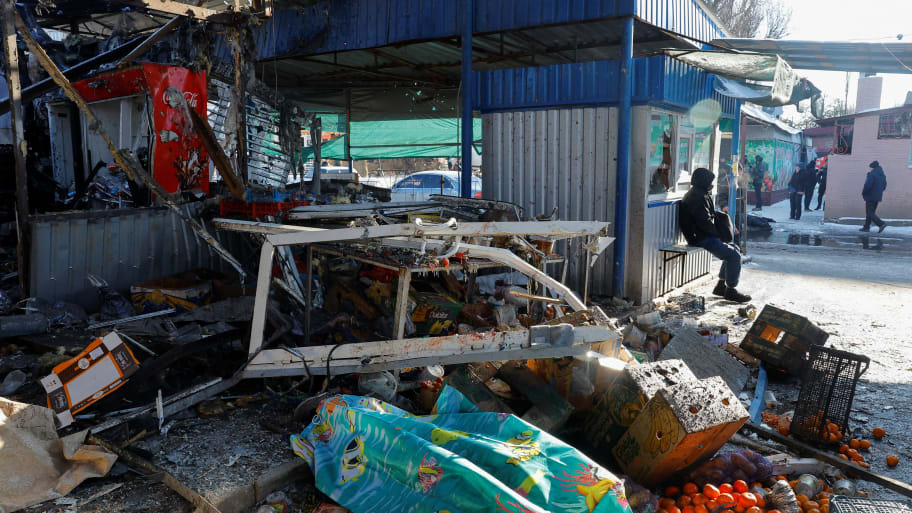 Aftermath of a deadly strike on a marketplace in Donetsk, which its Russian-backed leaders say came from Ukrainian artillery.